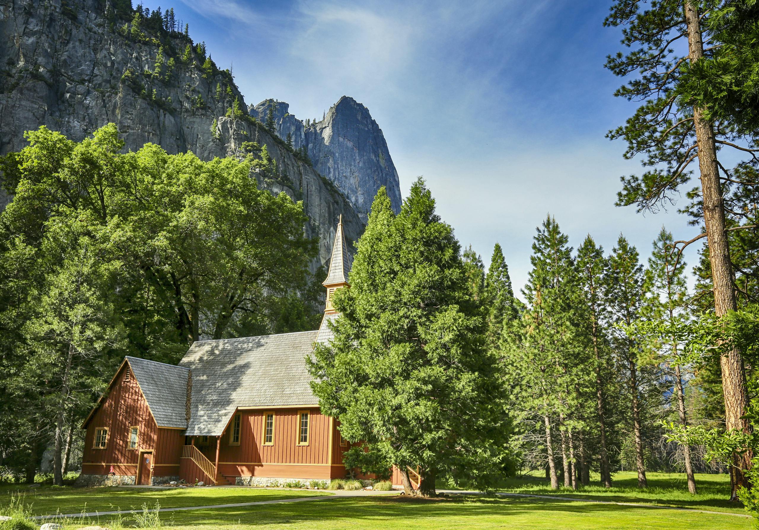 A Beautiful Yosemite Chapel Surrounded with Green Trees Near Rocky Mountain